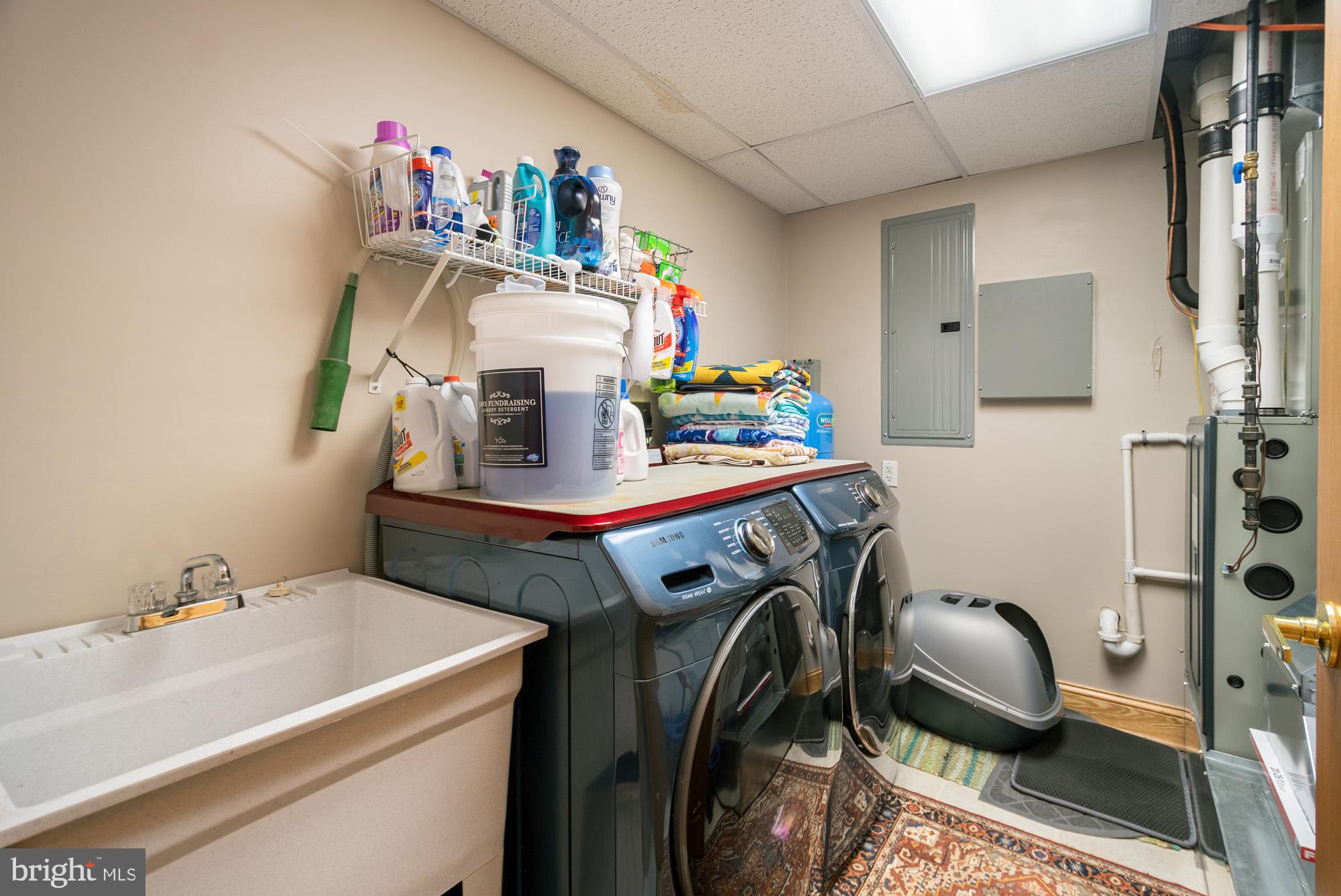 1875 Pysell Crosscut Road Oakland, MD 21550 - Photo 67 of 67 a utility room with dryer washer and a sink