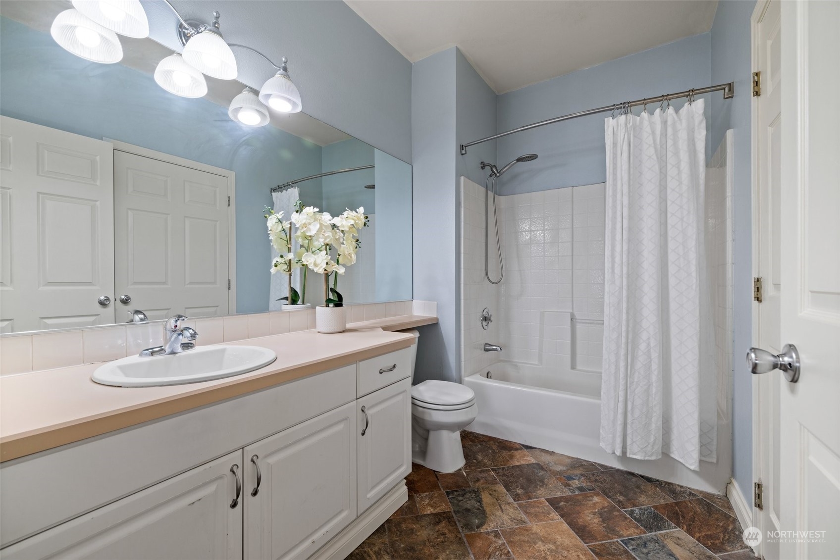 23908 Bothell Everett Highway, Unit B203 Bothell, WA 98021 - Photo 11 of 15 a bathroom with a double vanity sink mirror and toilet