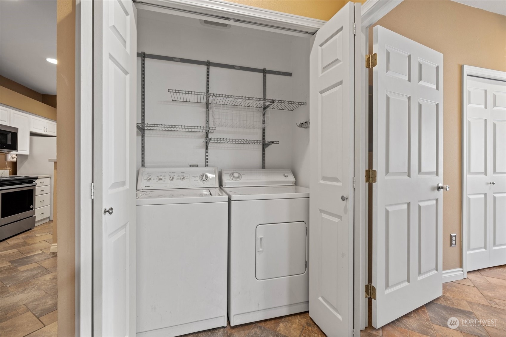 23908 Bothell Everett Highway, Unit B203 Bothell, WA 98021 - Photo 12 of 15 a utility room with dryer and washer
