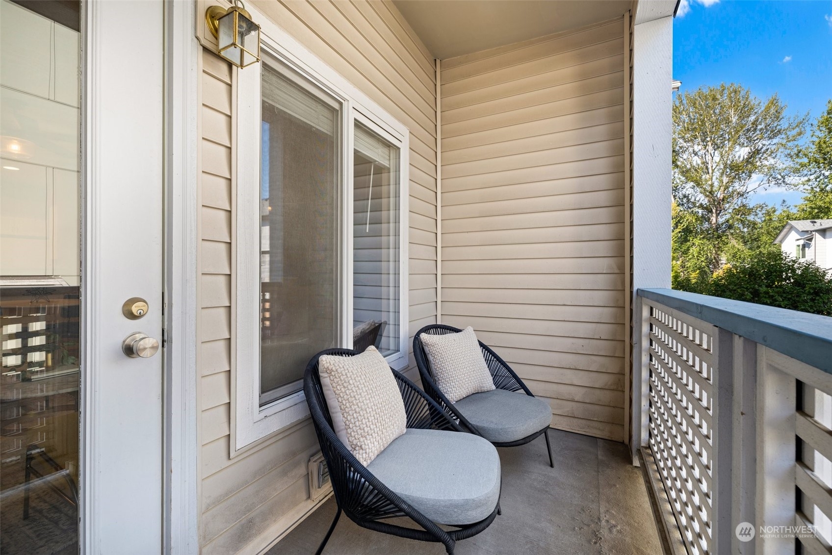 23908 Bothell Everett Highway, Unit B203 Bothell, WA 98021 - Photo 13 of 15 a view of a balcony with chair and a potted plant