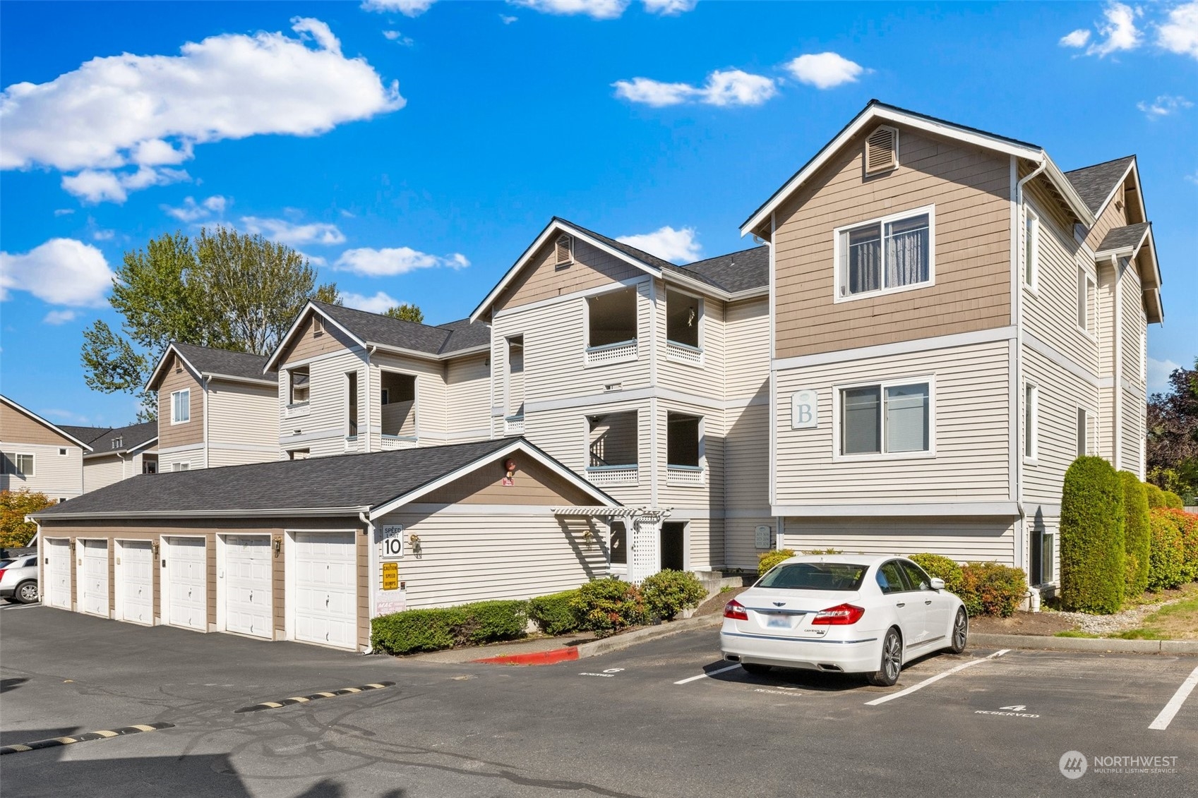 23908 Bothell Everett Highway, Unit B203 Bothell, WA 98021 - Photo 2 of 15 a car parked in front of a house
