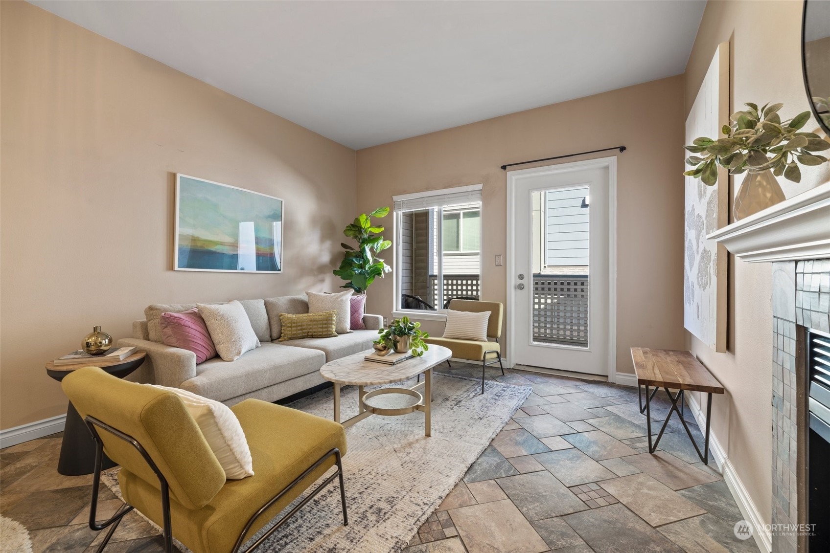 23908 Bothell Everett Highway, Unit B203 Bothell, WA 98021 - Photo 4 of 15 a living room with furniture a fireplace and a table