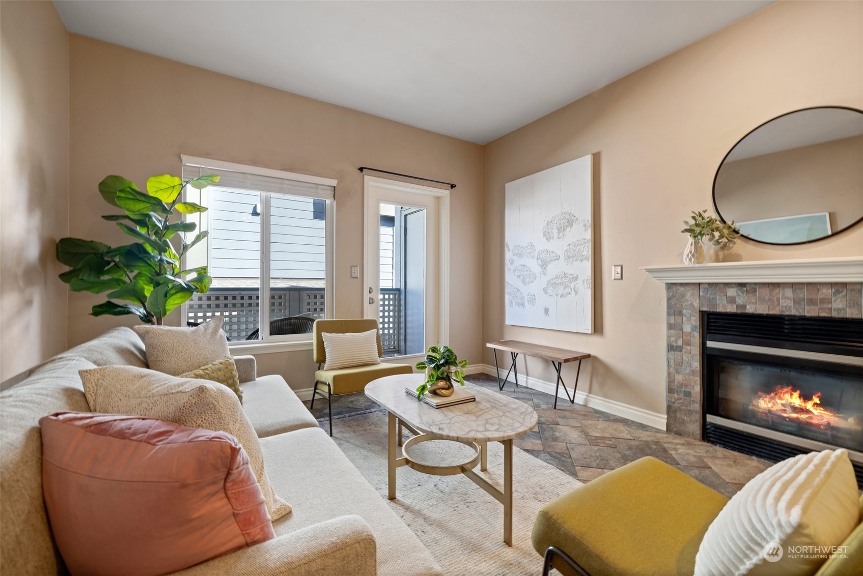 23908 Bothell Everett Highway, Unit B203 Bothell, WA 98021 - Photo 5 of 15 a living room with furniture a window and a fireplace