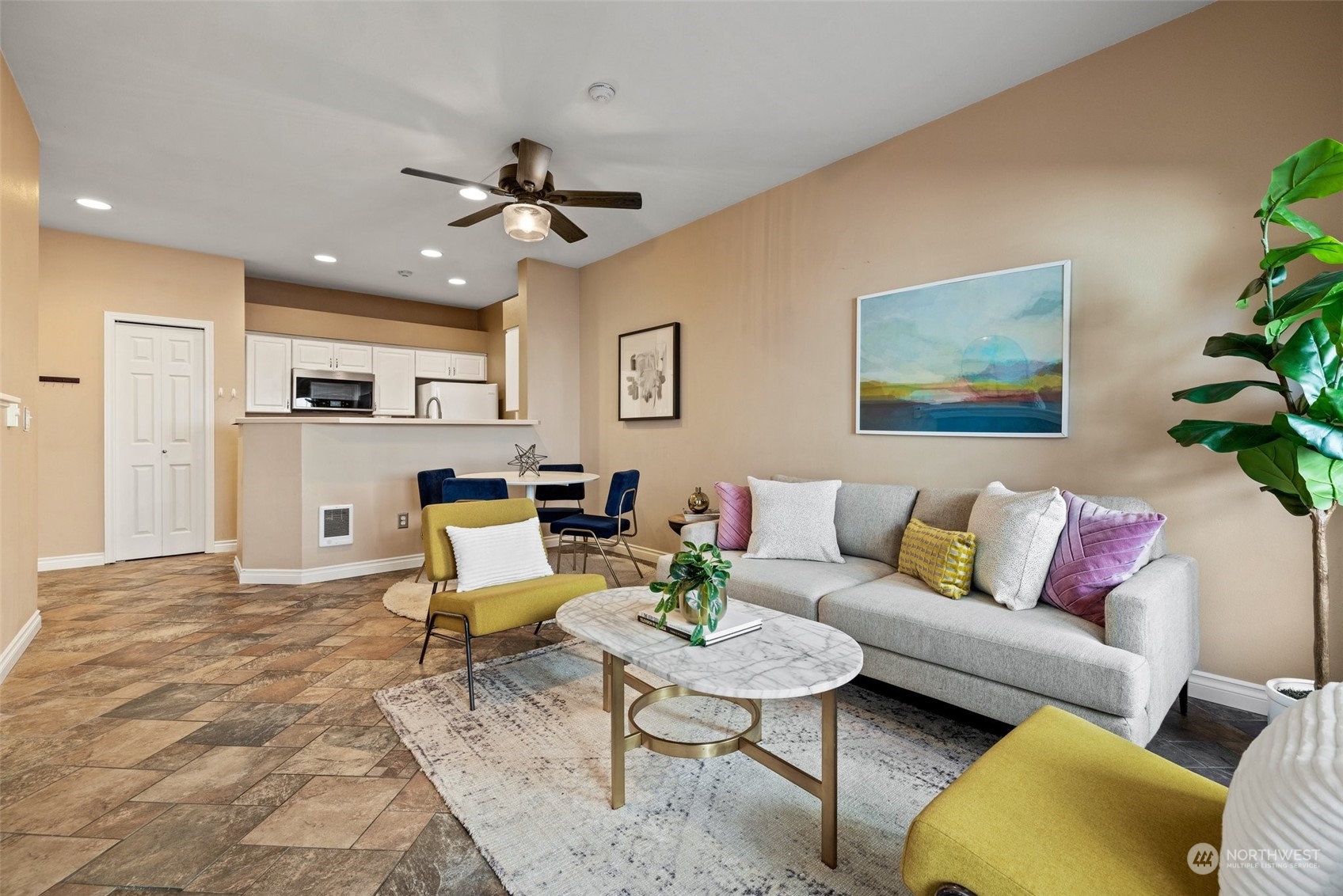 23908 Bothell Everett Highway, Unit B203 Bothell, WA 98021 - Photo 6 of 15 a living room with furniture and kitchen view