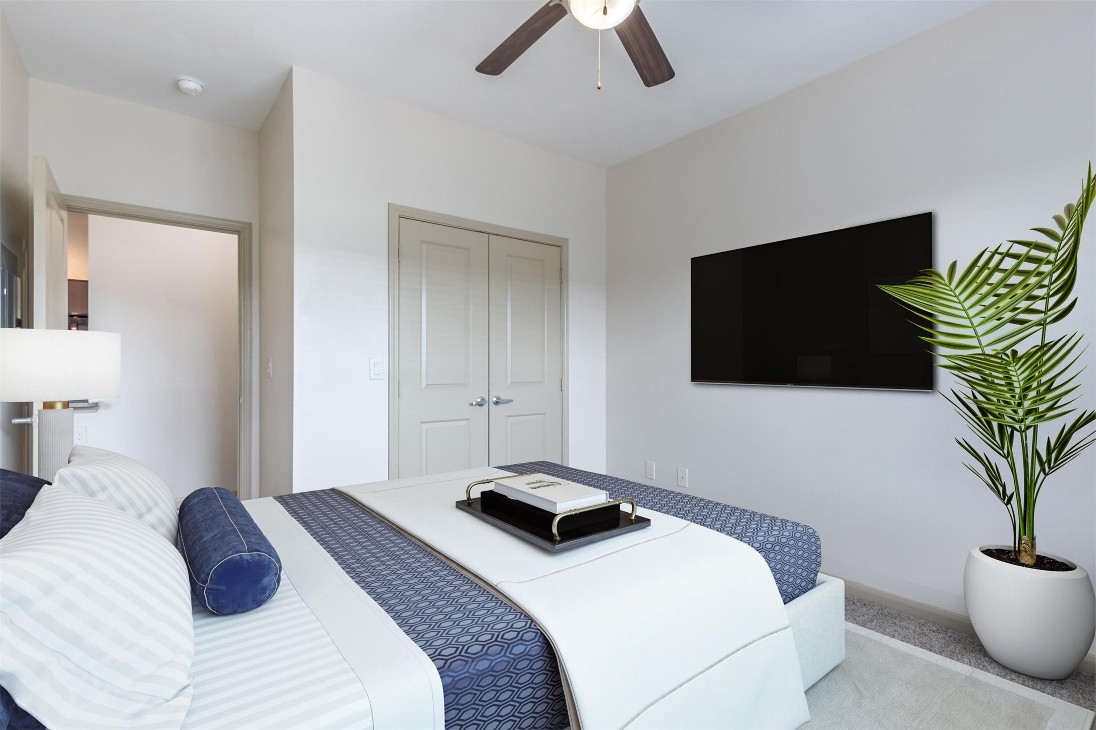 2930 Plum Creek Lane, Unit 1103 Houston, TX 77087 - Photo 4 of 14 a bedroom with a bed and a flat screen tv