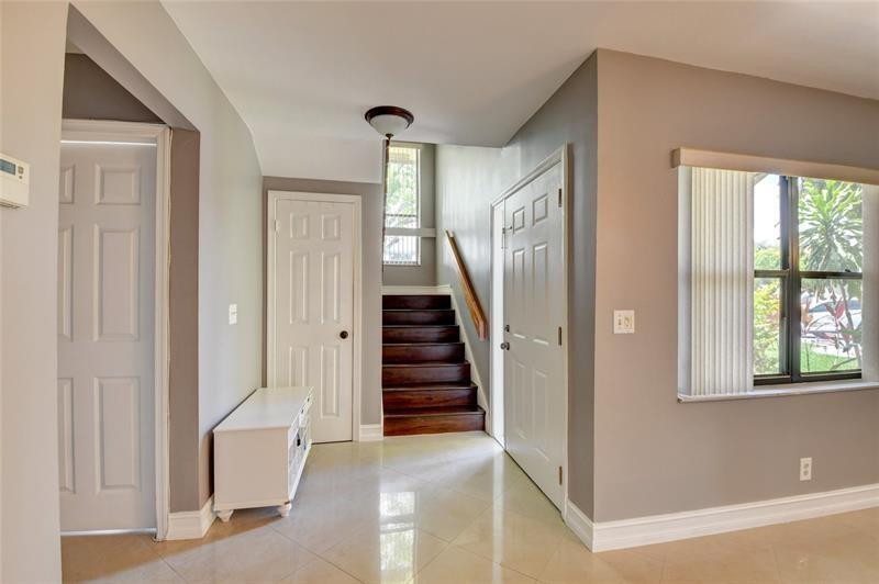 9316 Ketay Circle Boca Raton, FL 33428 - Photo 15 of 30 a view of a hallway with windows and entryway