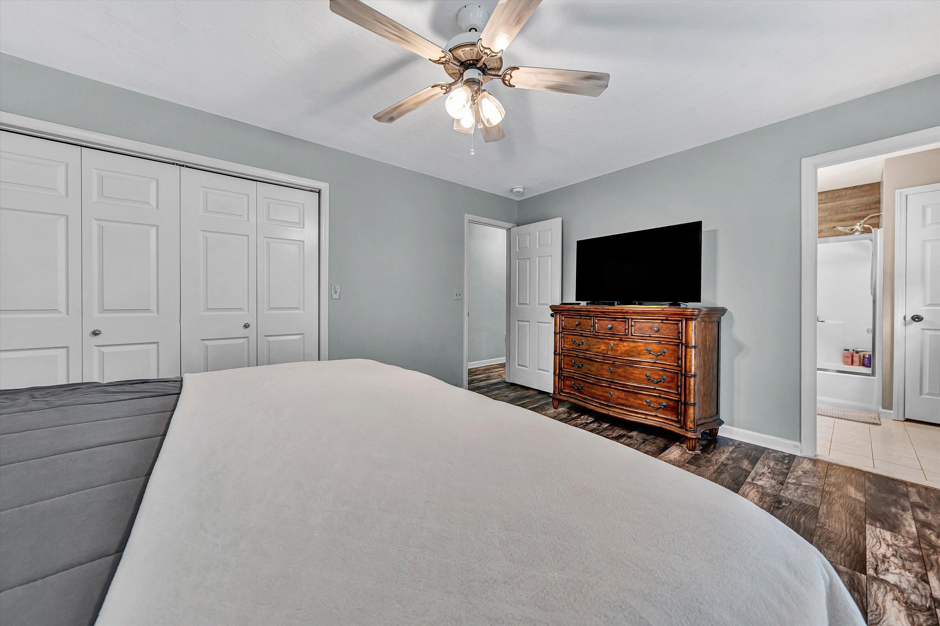 5935 Scruggs Road Moneta, VA 24121 - Photo 17 of 37 a bedroom with a bed and a flat screen tv