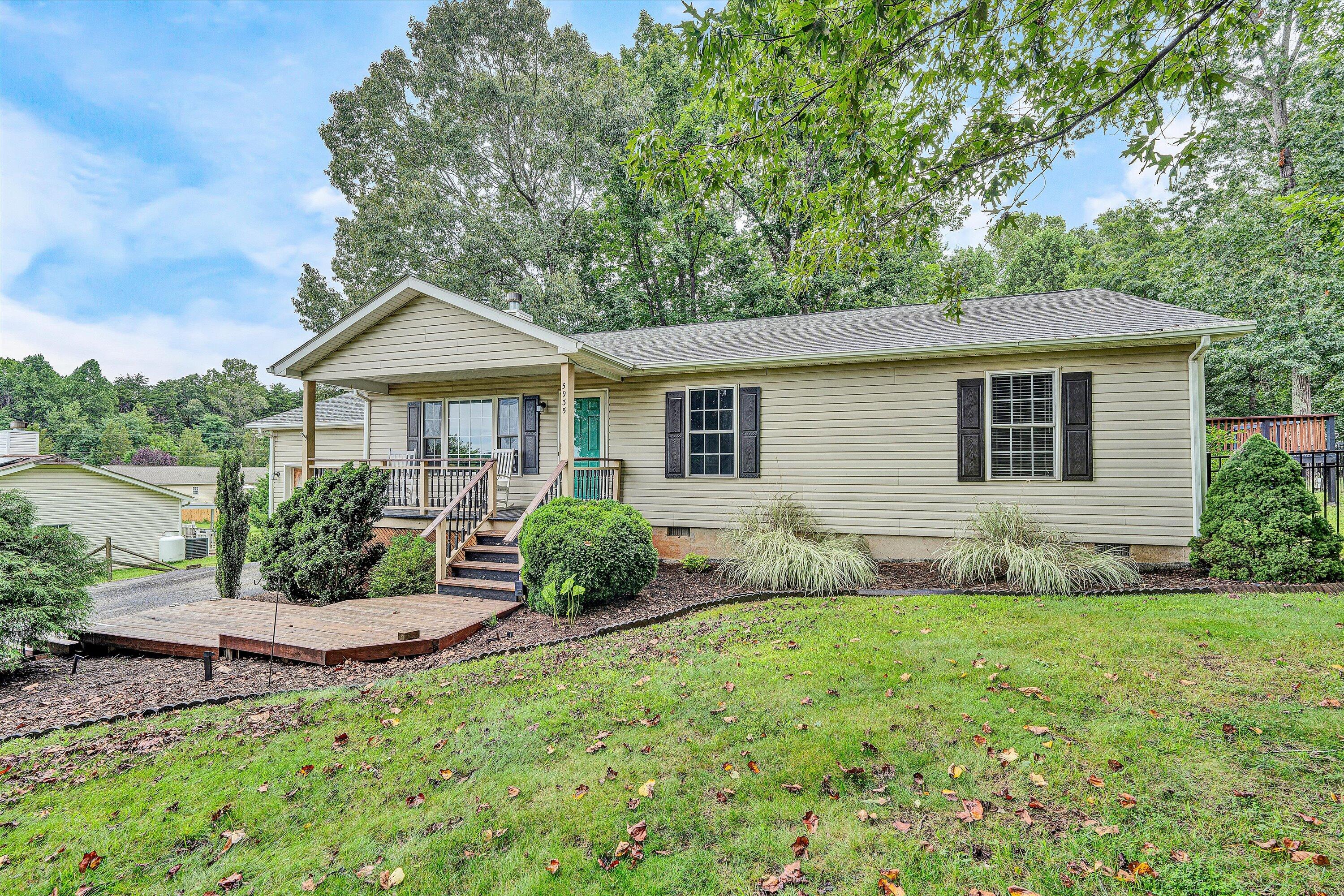 5935 Scruggs Road Moneta, VA 24121 - Photo 2 of 37 a front view of a house with garden