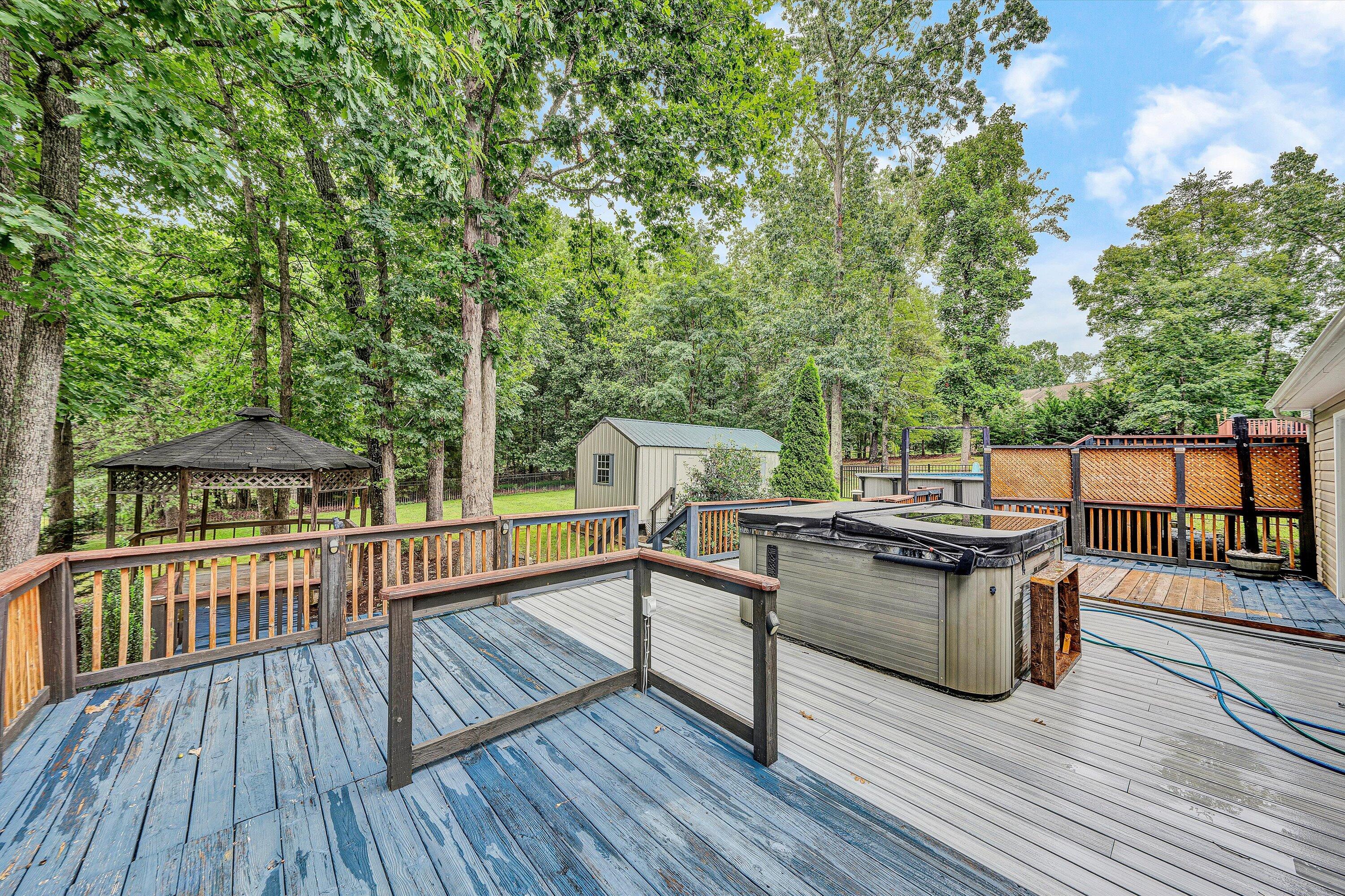 5935 Scruggs Road Moneta, VA 24121 - Photo 24 of 37 a view of a deck with chairs and wooden floor