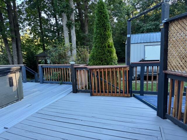5935 Scruggs Road Moneta, VA 24121 - Photo 25 of 37 a view of deck with wooden floor and fence with plants