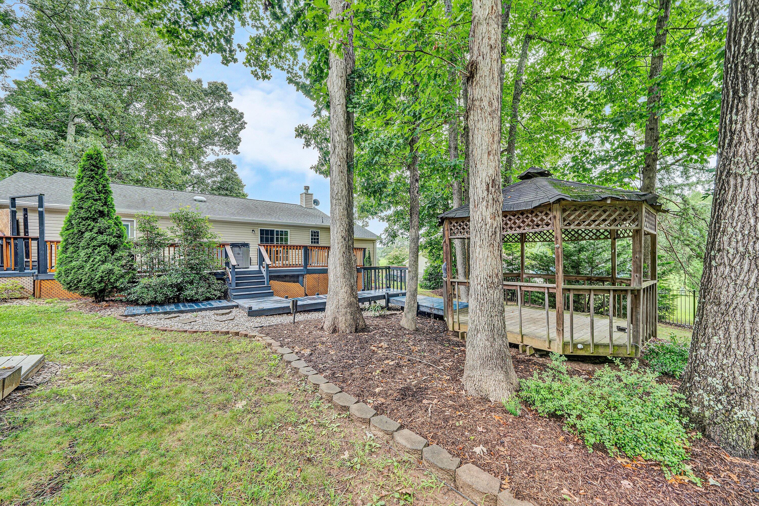 5935 Scruggs Road Moneta, VA 24121 - Photo 32 of 37 a view of a house with backyard and sitting area