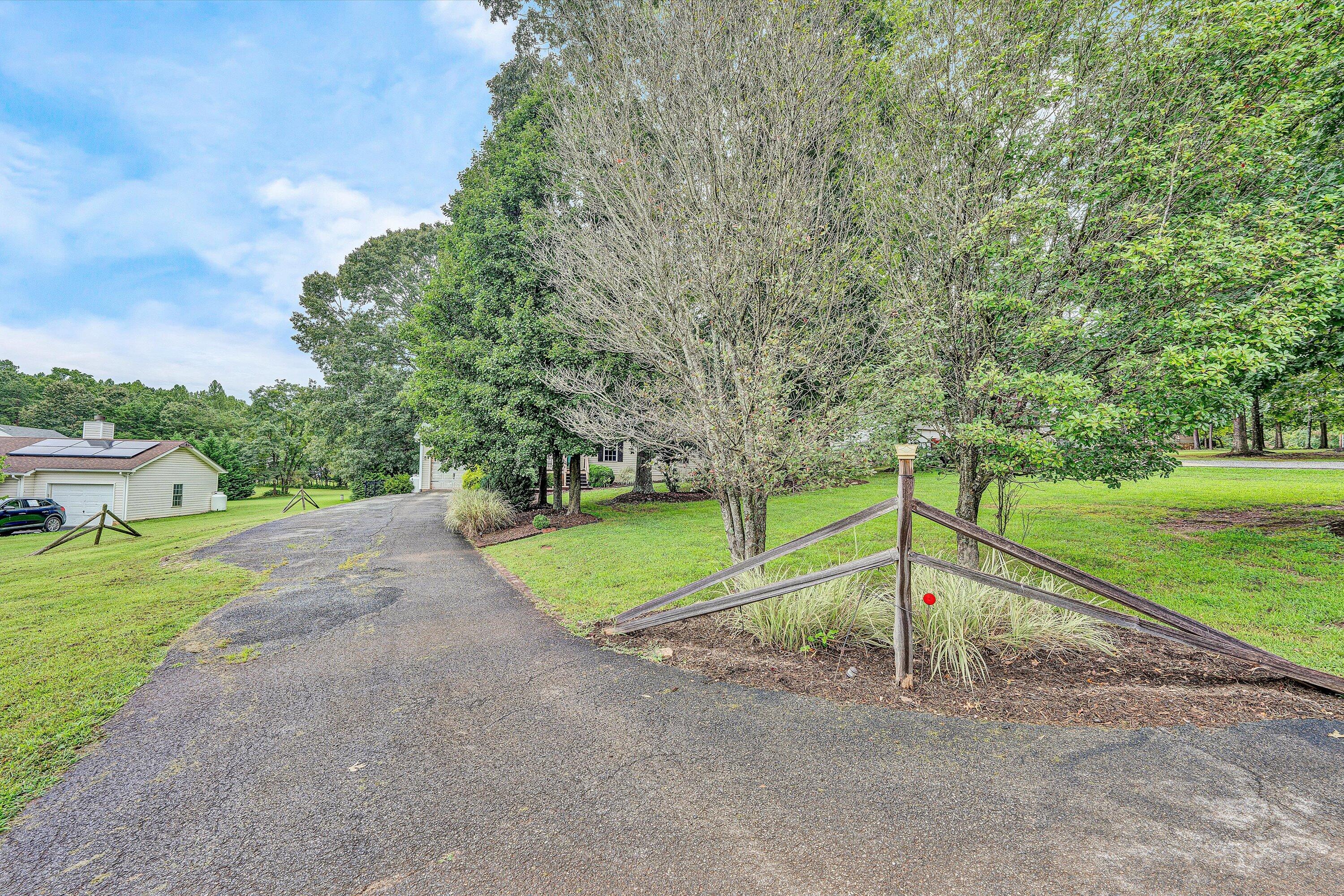 5935 Scruggs Road Moneta, VA 24121 - Photo 36 of 37 a green field with lots of trees in the background