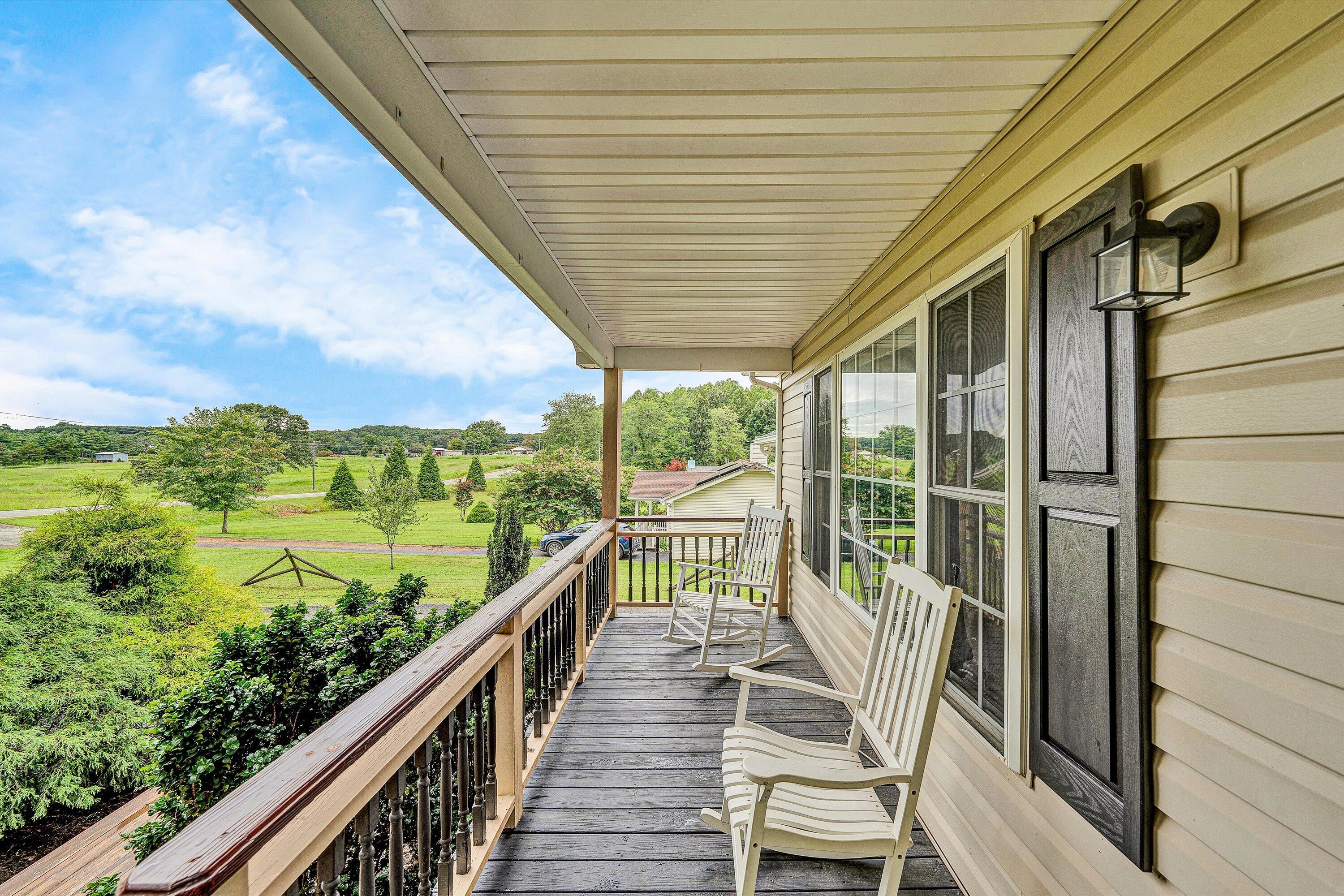 5935 Scruggs Road Moneta, VA 24121 - Photo 5 of 37 a view of a deck with wooden floor and outdoor seating