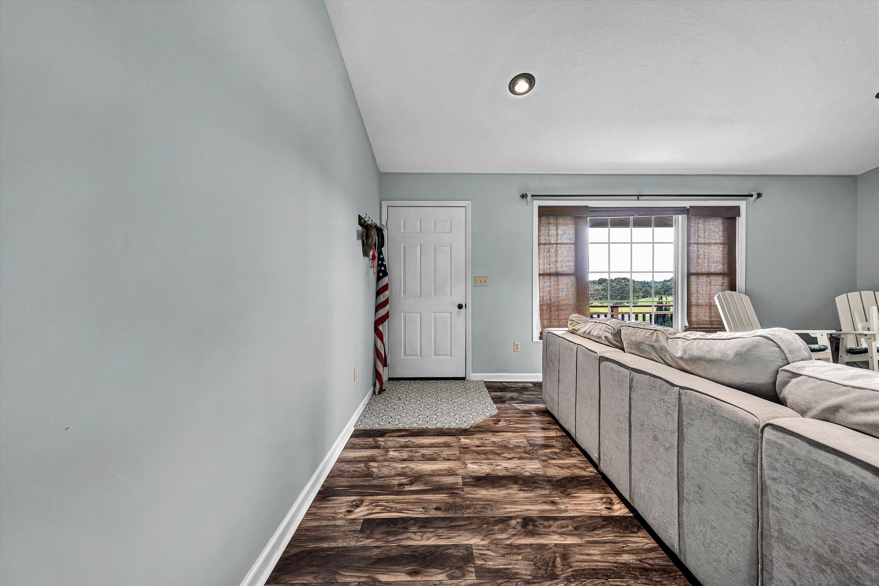 5935 Scruggs Road Moneta, VA 24121 - Photo 6 of 37 a living room with furniture and a rug