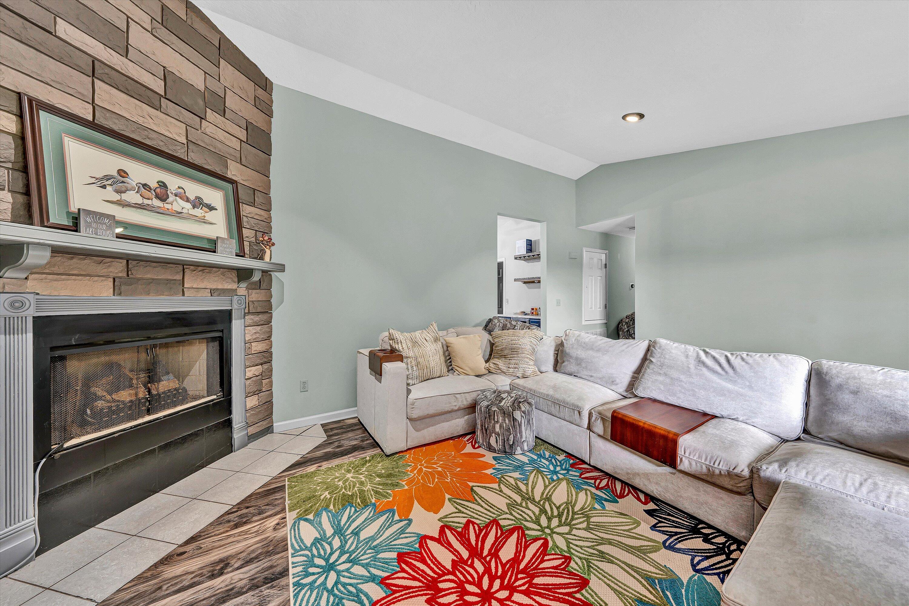 5935 Scruggs Road Moneta, VA 24121 - Photo 8 of 37 a living room with furniture and a fireplace