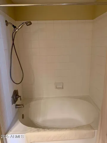 a bathroom with a bath tub