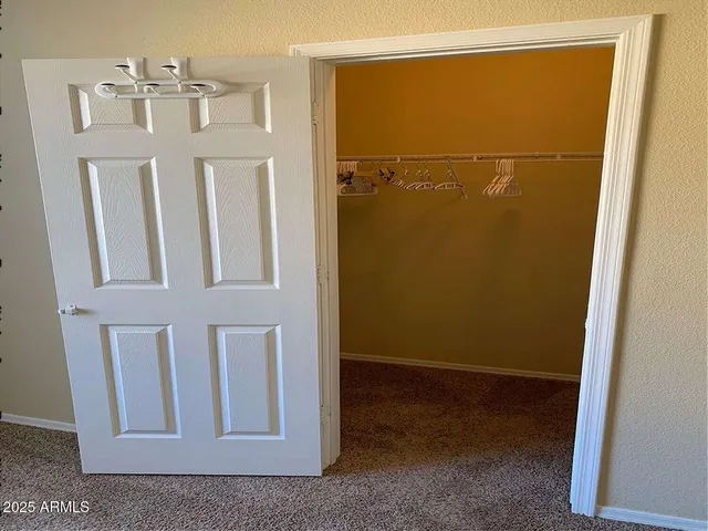 a view of a dining room with furniture and window
