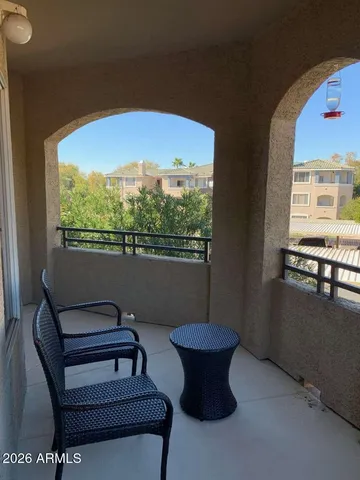 a view of a chairs and table in a room