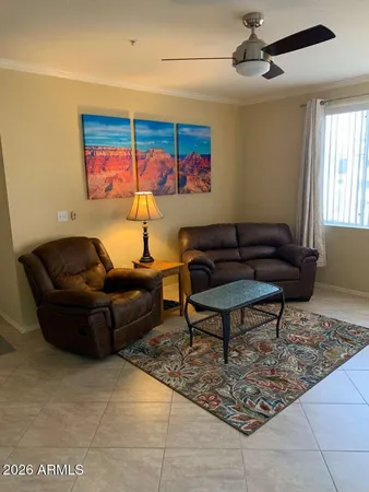 a living room with furniture and a rug