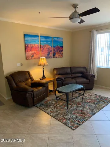 a living room with furniture and a rug