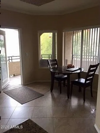 a view of a dining room with furniture and window