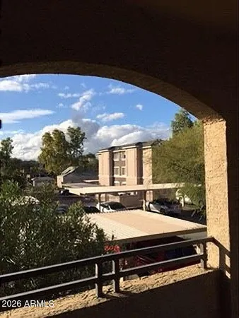 a view of kitchen with furniture and a refrigerator