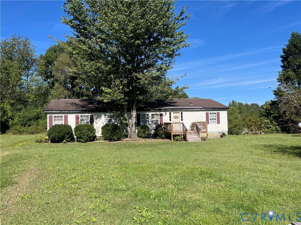 6394 Cross County Road Mineral, VA 23117 - Photo 1 of 4 a view of a house with a yard