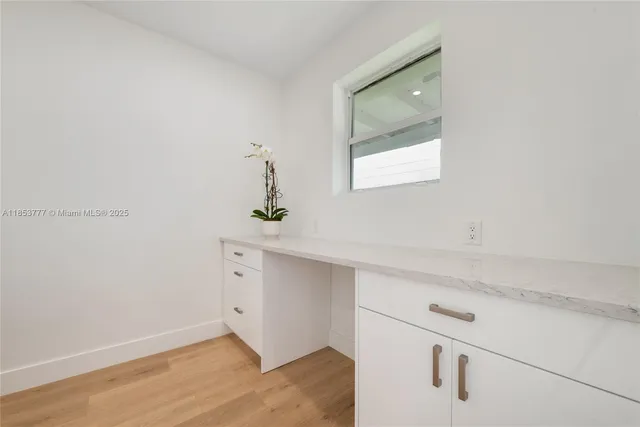 a view of an entryway with wooden floor