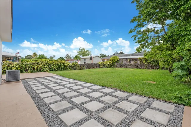 a view of a garden with an buildings