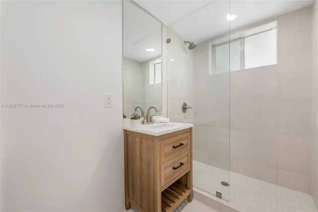 a bathroom with a sink a mirror and a bathtub