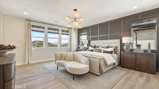 a bed room with a bed mirror and a window