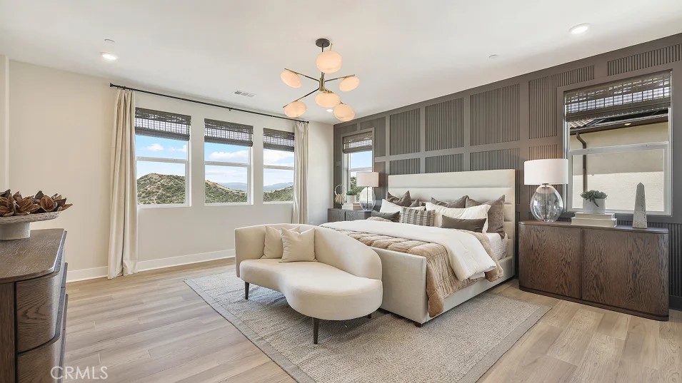 24328 Calle La Roca Valencia, CA 91354 - Photo 12 of 41 a spacious bedroom with a bed and a couch