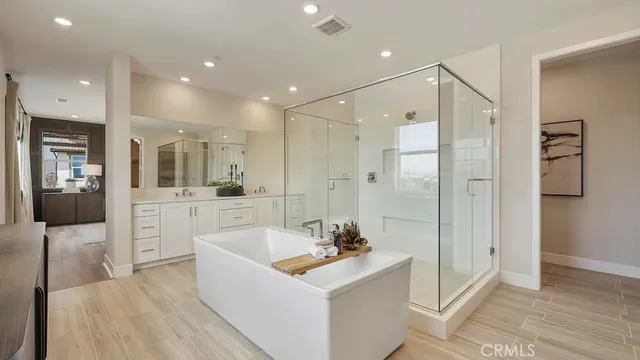 a spacious bathroom with a shower and a sink