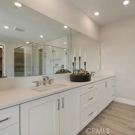 24328 Calle La Roca Valencia, CA 91354 - Photo 16 of 41 a bathroom with a sink double vanity and a mirror
