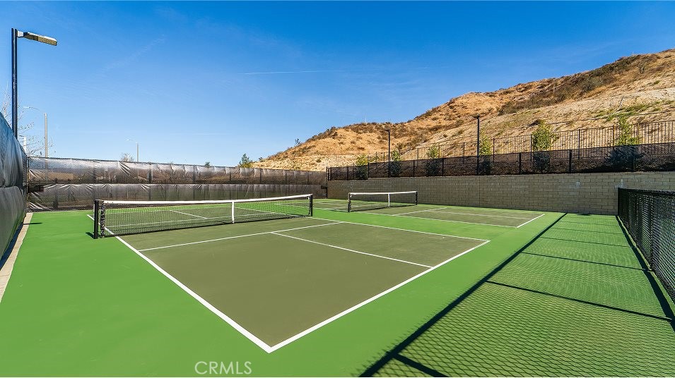 24328 Calle La Roca Valencia, CA 91354 - Photo 34 of 41 a view of a tennis court