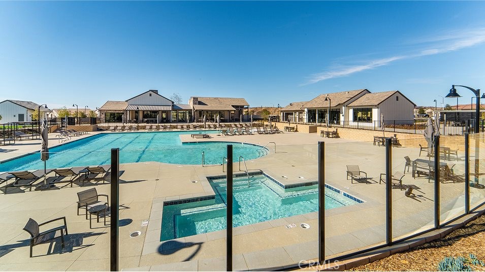 24328 Calle La Roca Valencia, CA 91354 - Photo 35 of 41 a view of a houses with a big yard and potted plants