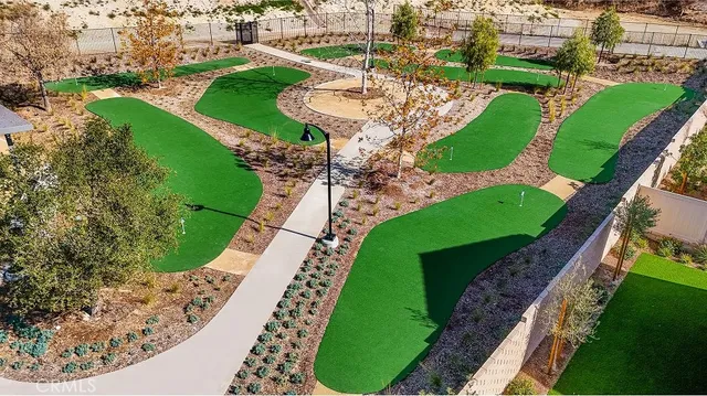 an aerial view of a house with a yard and lake view