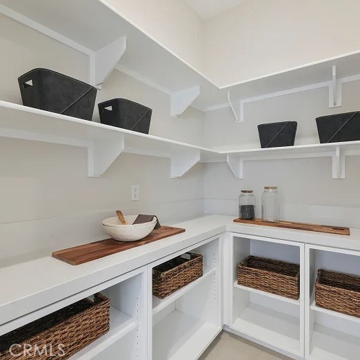 24328 Calle La Roca Valencia, CA 91354 - Photo 5 of 41 a kitchen with a stove and a refrigerator