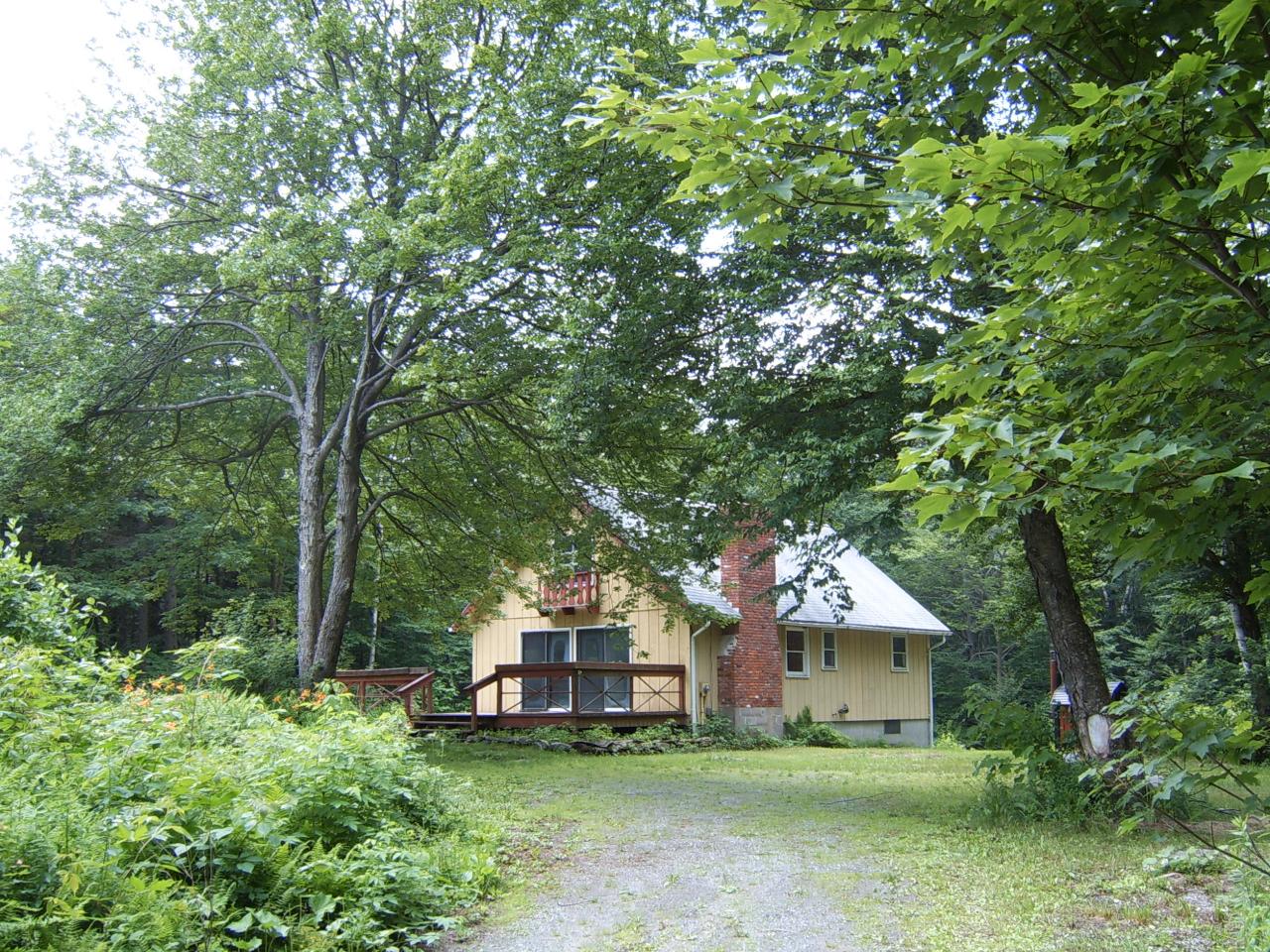 141 Plumb Road Becket, MA 01223 - Photo 2 of 10 a view of a house with a yard