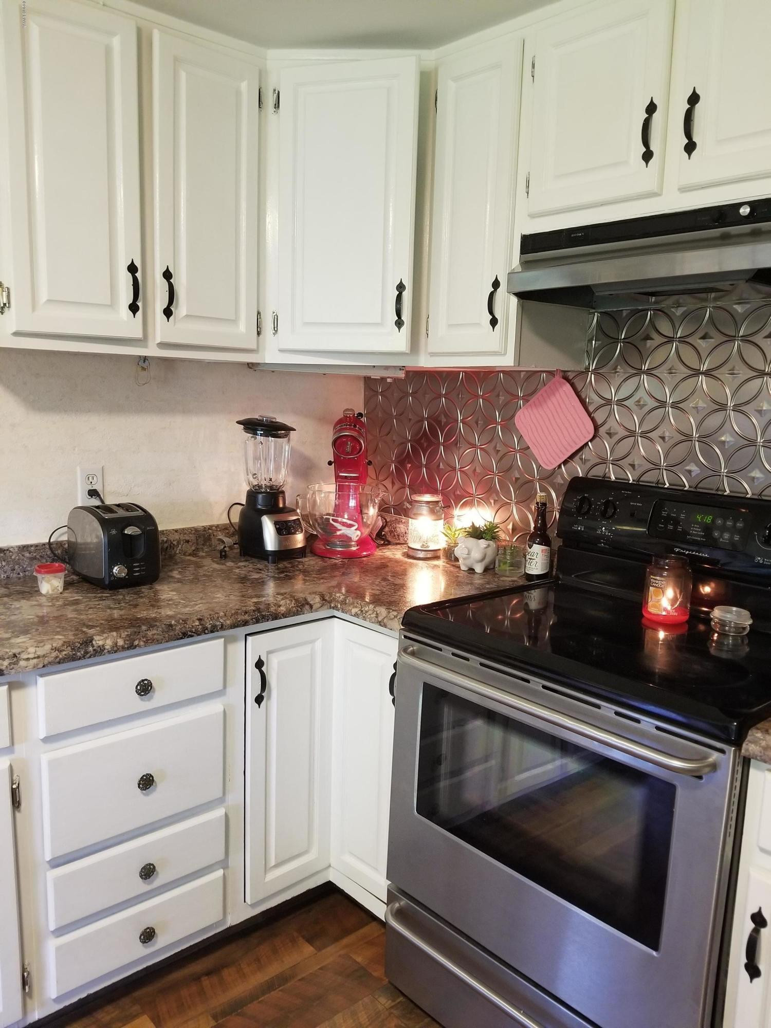 144 Mid Valley Road Lake Ariel, PA 18436 - Photo 11 of 55 a kitchen with white cabinets and appliances