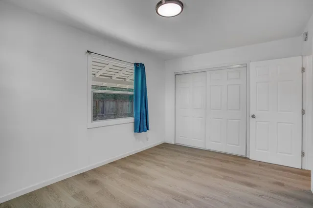 a front view of a house with a yard and sitting area