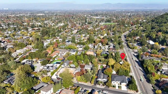 a backyard of a house with plants and trees