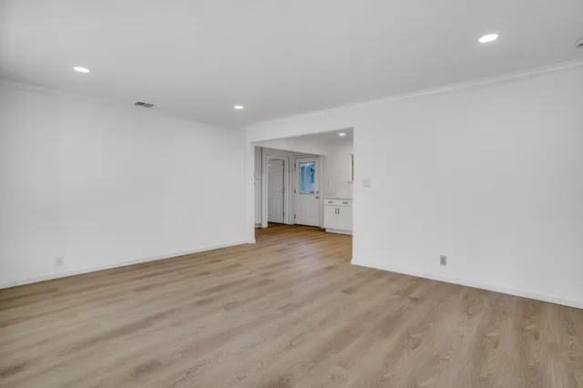 a view of a kitchen with a sink and a stove top oven
