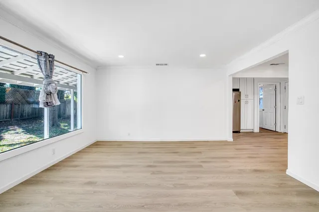 a view of an empty room with a window