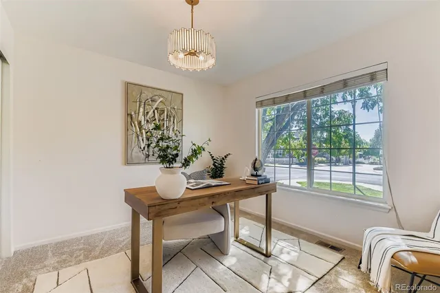 a view of a dining room with furniture window and outside view