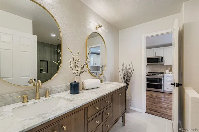 a bathroom with a double vanity sink and a mirror