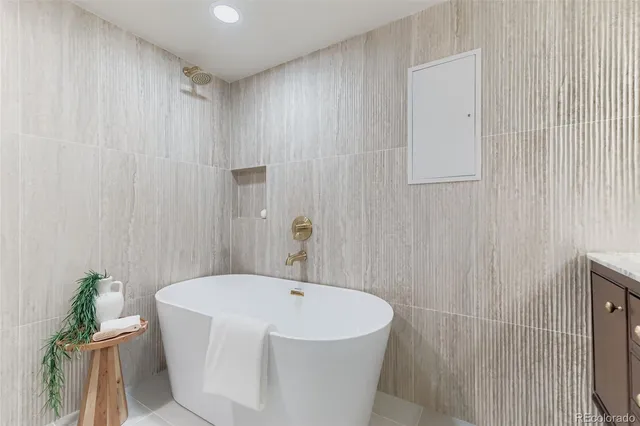 a white bath tub sitting in a bathroom
