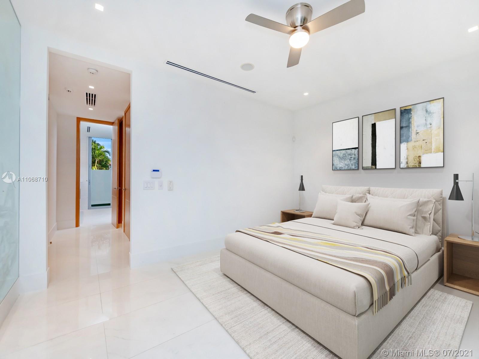 761 Glenridge Road Key Biscayne, FL 33149 - Photo 11 of 19 a bedroom with a bed and ceiling fan