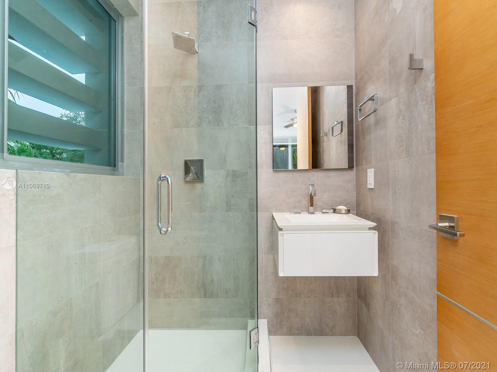 761 Glenridge Road Key Biscayne, FL 33149 - Photo 18 of 19 a bathroom with a sink a toilet and shower