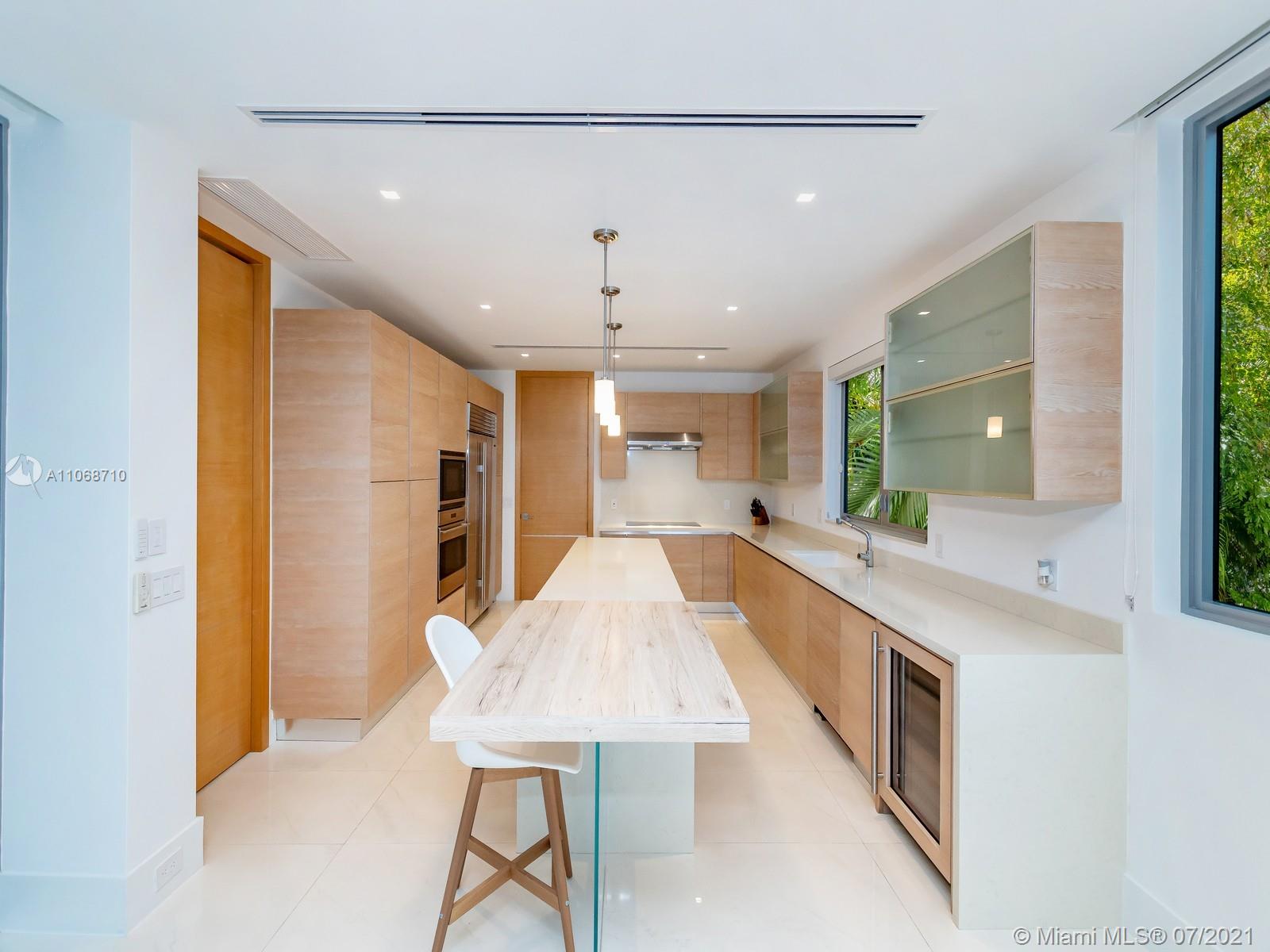 761 Glenridge Road Key Biscayne, FL 33149 - Photo 4 of 19 a large white kitchen with a large window